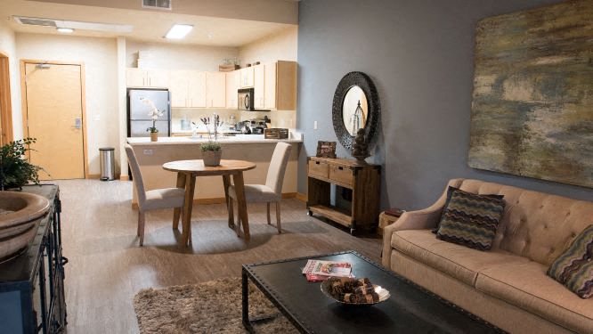 a living room with a couch and a table